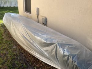 protect bushes with plastic cover before chemically cleaning roof